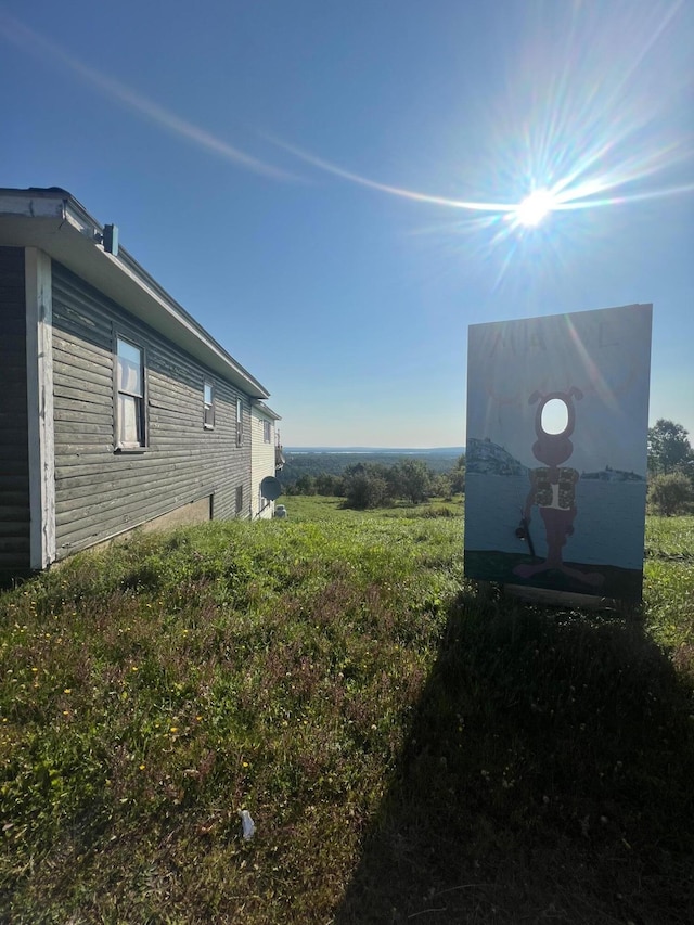 view of yard with a rural view