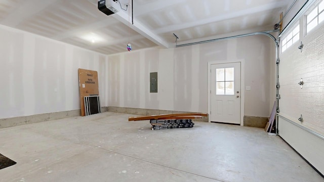 garage featuring a garage door opener and electric panel