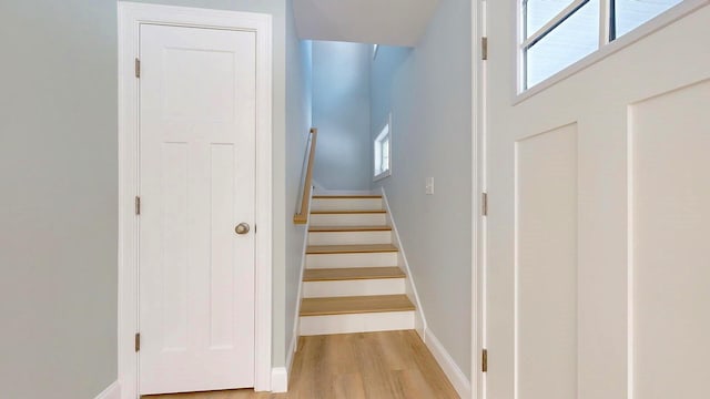 stairs featuring hardwood / wood-style flooring