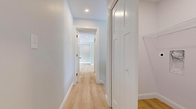 laundry room featuring light hardwood / wood-style floors and hookup for an electric dryer