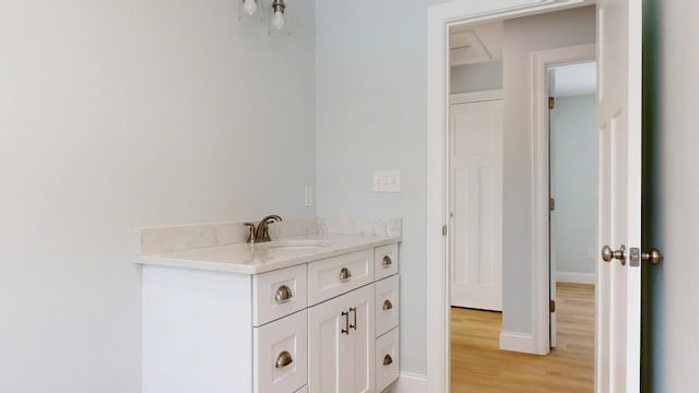 bathroom featuring vanity and hardwood / wood-style floors