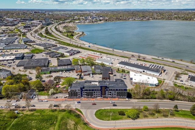 birds eye view of property with a water view