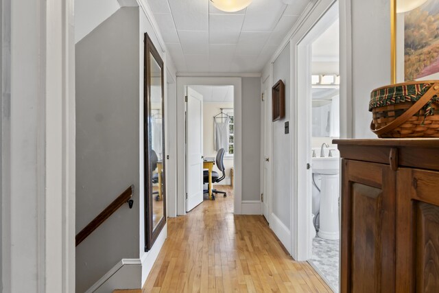 corridor featuring light hardwood / wood-style floors