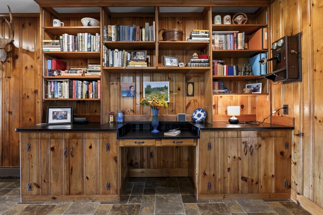 interior space featuring wooden walls