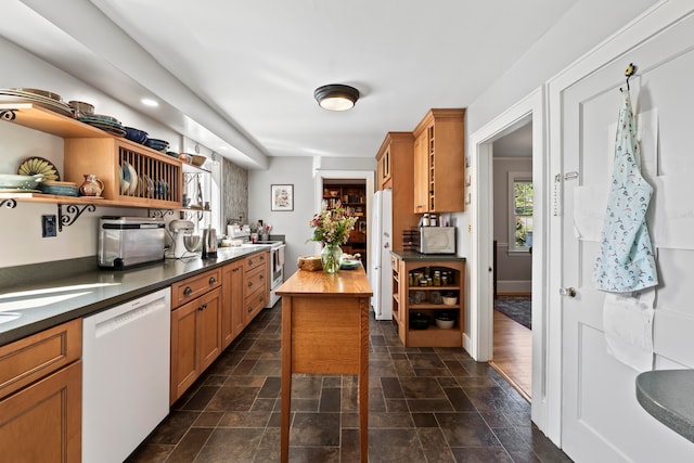 kitchen featuring white appliances and butcher block countertops