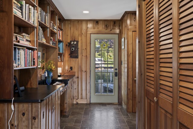 interior space featuring wood walls