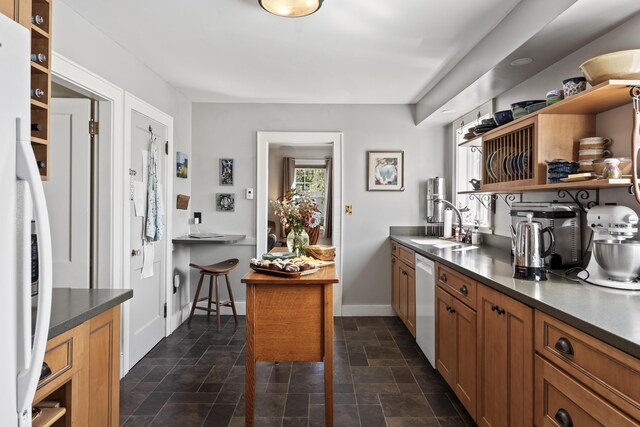 kitchen with sink and white appliances