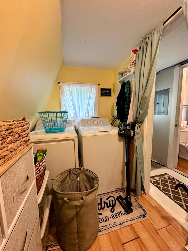 32 Dinsmore Ln, Whiting, ME 04691 - laundry area featuring wood finished floors, washing machine and clothes dryer, and electric panel