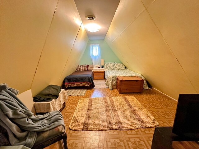 bedroom featuring vaulted ceiling