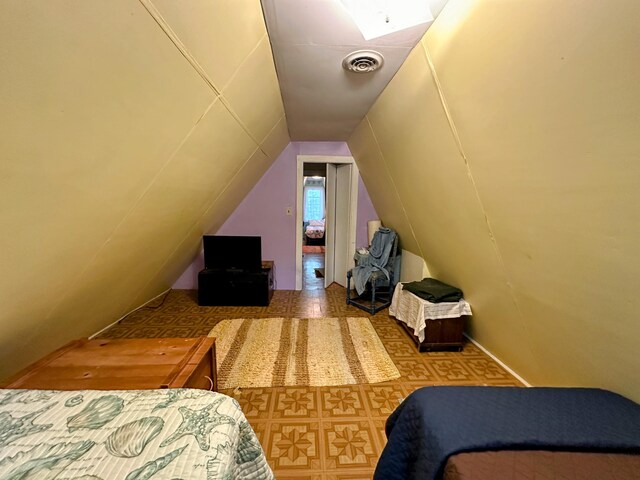 bedroom featuring vaulted ceiling