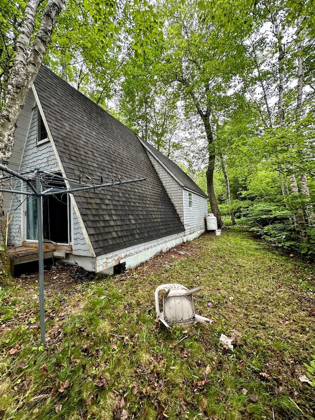 32 Dinsmore Ln, Whiting, ME 04691 - view of side of property featuring roof with shingles