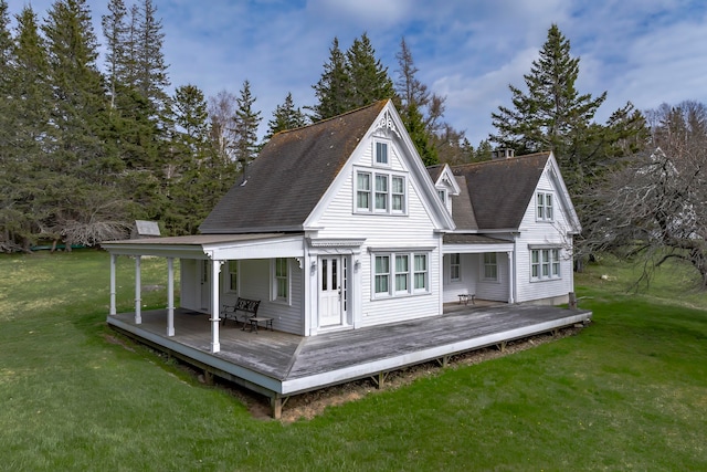 back of house with a porch, a deck, and a yard