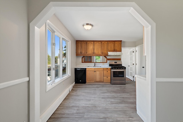 kitchen with dishwasher, stainless steel range with gas stovetop, a baseboard heating unit, light hardwood / wood-style floors, and sink