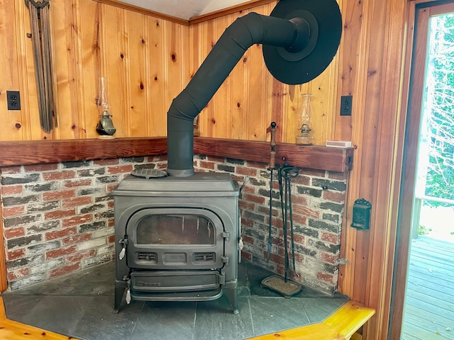 details featuring wood walls and a wood stove