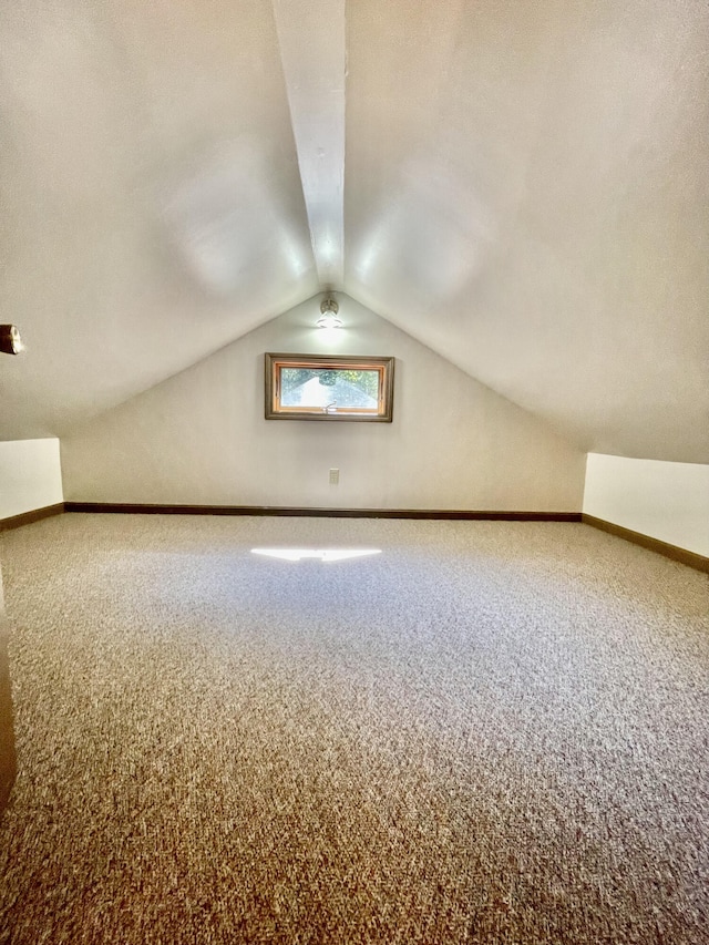 bonus room featuring carpet floors and lofted ceiling