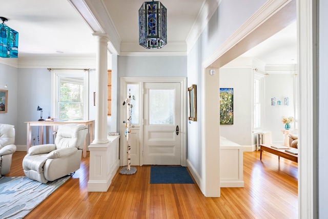 entrance foyer featuring light hardwood / wood-style flooring and ornamental molding