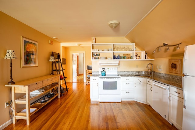 kitchen with sink, hardwood / wood-style floors, decorative light fixtures, white cabinetry, and white appliances