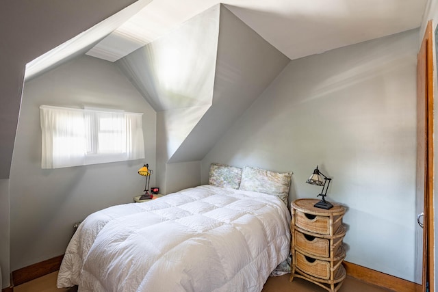 bedroom featuring vaulted ceiling