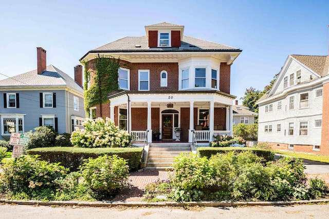 view of front of home featuring covered porch