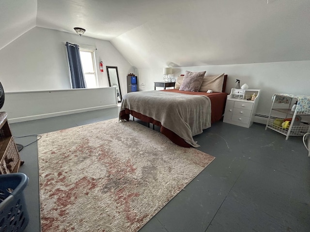 bedroom with lofted ceiling, a baseboard heating unit, and concrete flooring