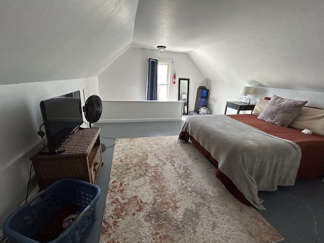 bedroom with carpet floors and vaulted ceiling