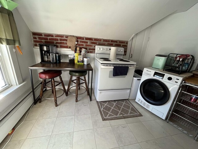 clothes washing area with brick wall and washer / dryer