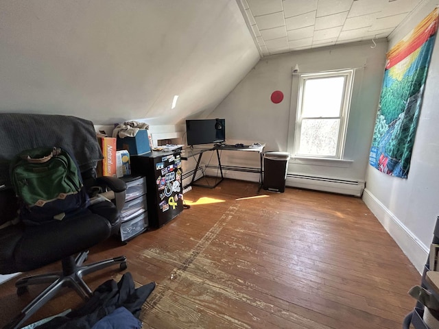home office featuring hardwood / wood-style floors, lofted ceiling, baseboards, and a baseboard radiator