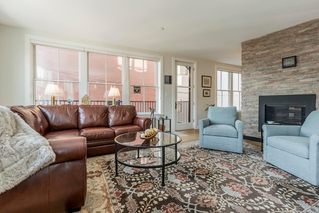 living room with hardwood / wood-style flooring and a fireplace