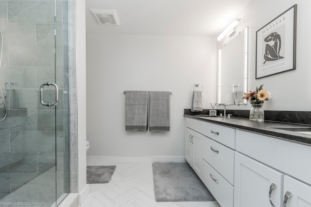 bathroom featuring walk in shower, vanity, and toilet