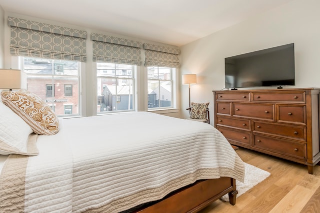 bedroom with light wood-type flooring