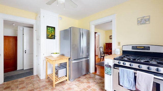 kitchen with ceiling fan and appliances with stainless steel finishes