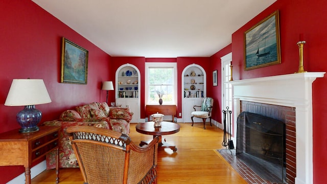 living room featuring a fireplace and hardwood / wood-style flooring