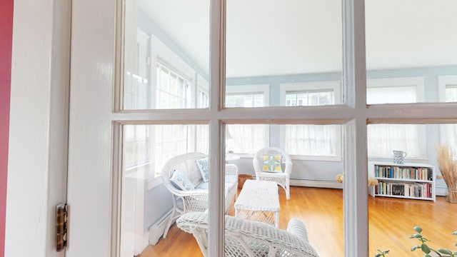 sunroom / solarium with a baseboard radiator