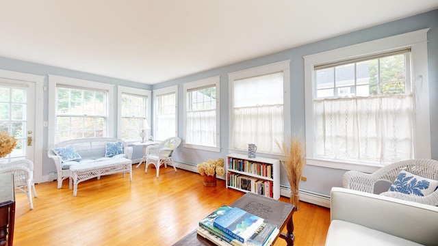 sunroom with a baseboard radiator