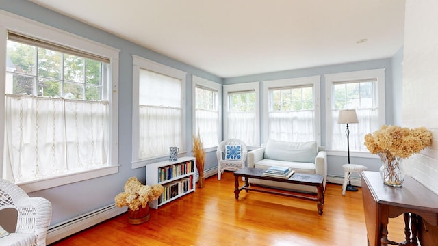 sunroom / solarium featuring a baseboard radiator