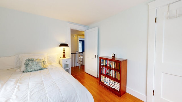 bedroom with hardwood / wood-style flooring