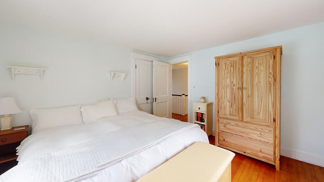 bedroom with wood-type flooring