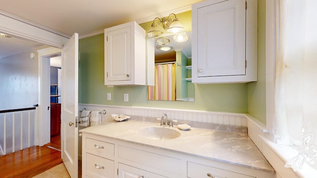 bathroom featuring vanity and hardwood / wood-style floors