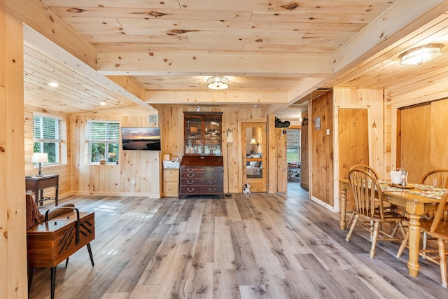 entryway with wood ceiling, wooden walls, and hardwood / wood-style flooring