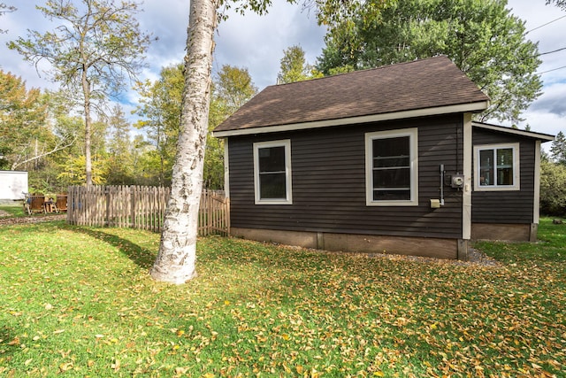 view of property exterior featuring a lawn