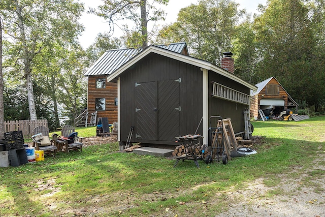 view of outdoor structure with a lawn