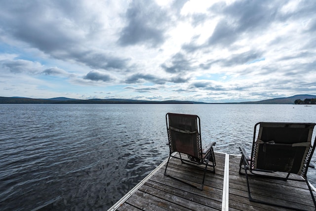 dock area with a water and mountain view