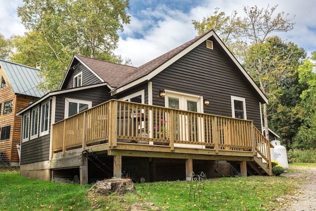 back of house with a wooden deck