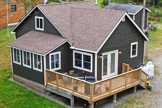 back of property featuring a wooden deck