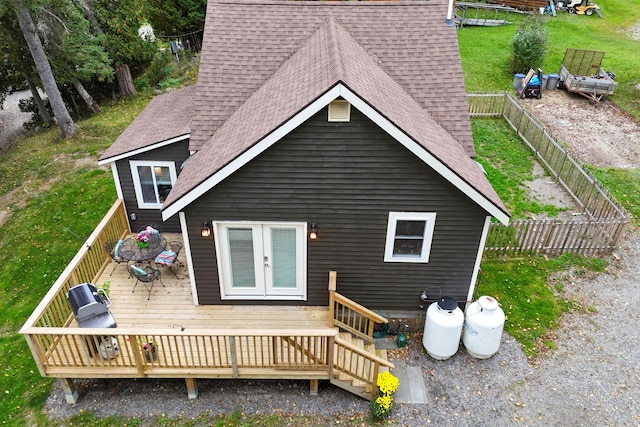 rear view of house with a wooden deck