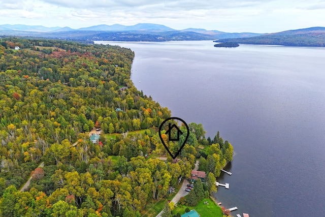 aerial view featuring a water and mountain view