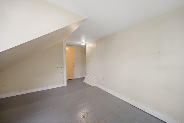 additional living space with vaulted ceiling