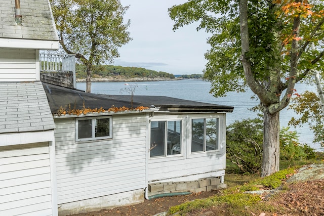 view of home's exterior featuring a water view