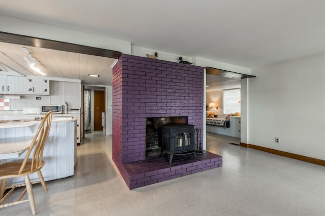 living room with a wood stove