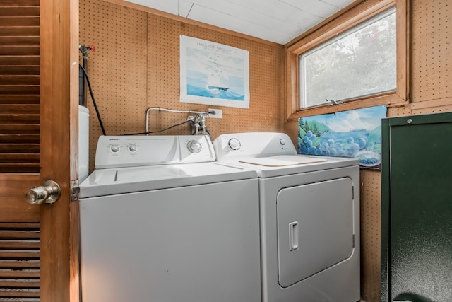 washroom with washing machine and clothes dryer